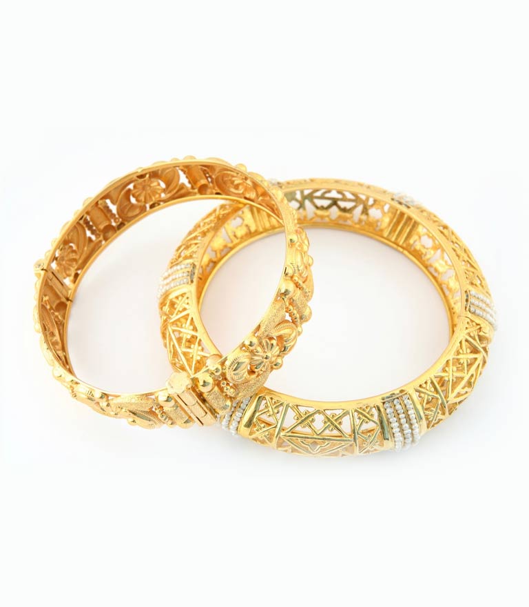 A pair of 22k gold bracelets